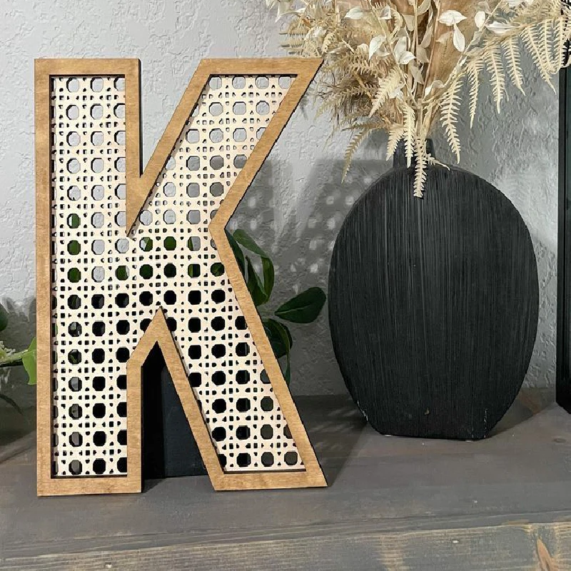 k letter covered by rattan mesh